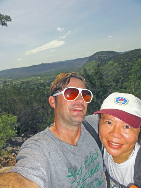 happy couples hike to the tops of mountains