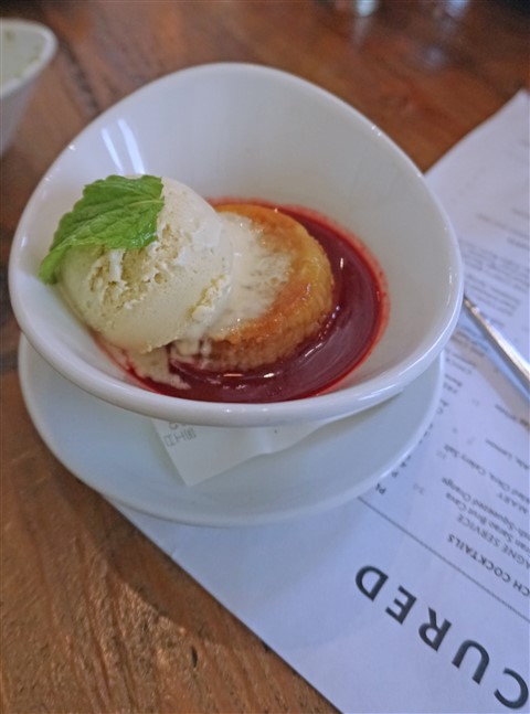 zuchini ice cream over peach upside down cake and berry soup at cured san antonio pearl