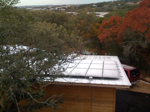 pv panels with snow in austin