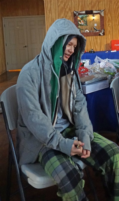 man with multiple hoodies for christmas