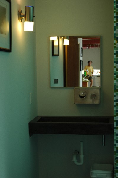 cast concrete sink with wall mounte fixture