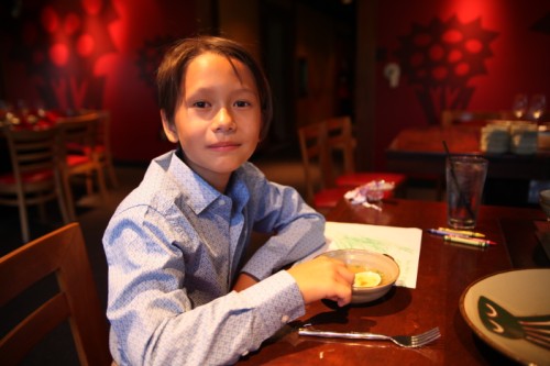happy boy at benihana dallas with soup