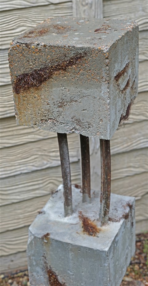 sculptor paul schuster  austin concrete totem patina