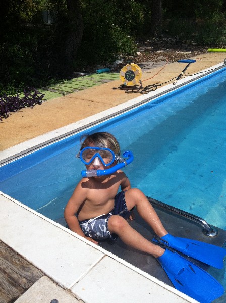 toddler in flippers and swim goggles toddler in flippers and swim goggles