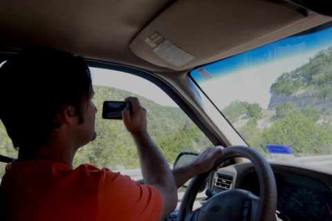 texting while driving, or taking pics while driving