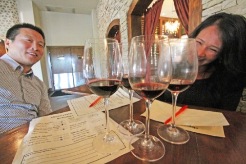 scrutinizing the wine at eleven plates and wine westlake austin  scrutinizing the wine at eleven plates and wine westlake austin