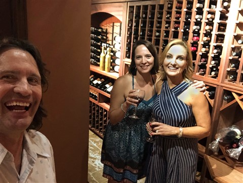 caveman with mullet photobombs pretty girls